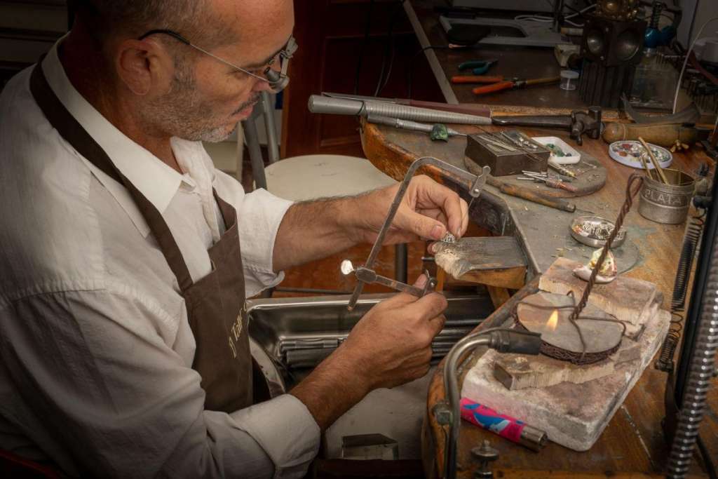 JC at his bench working on a repair piece