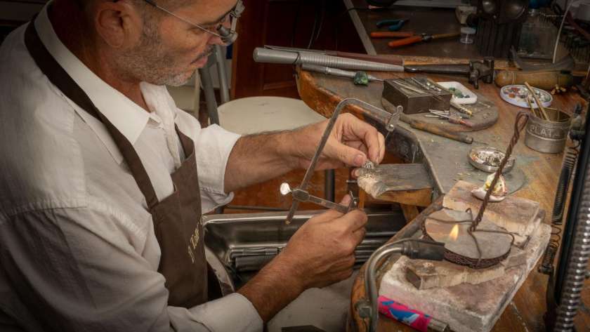 JC at his bench working on a repair piece